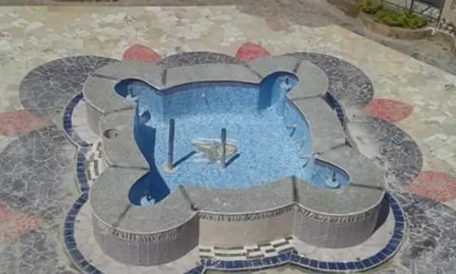 Ornamental fountain basin during construction