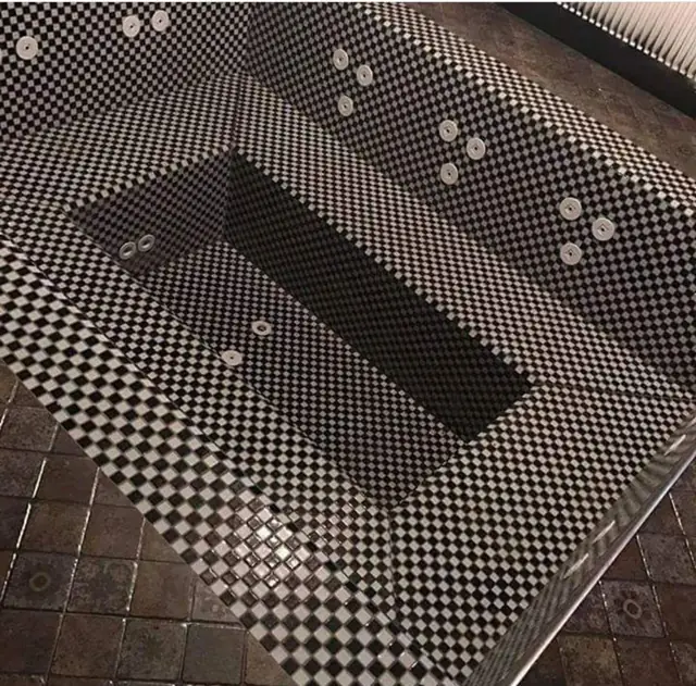 Spa with black-and-white mosaic finish
