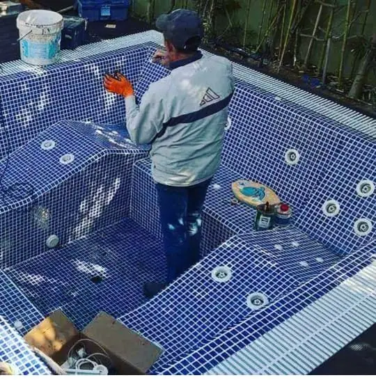Mosaic tiling and jet fittings inside a spa basin