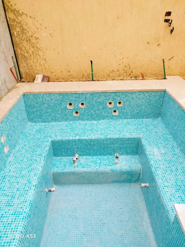 Square spa with bench seating and jets after finishing
