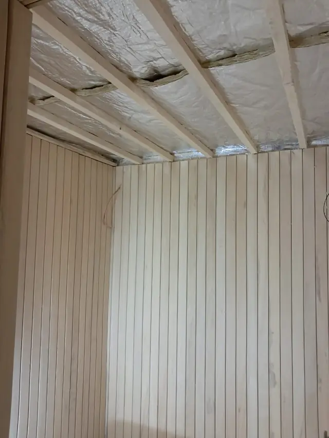 Sauna timber lining with aluminium vapour barrier on the ceiling
