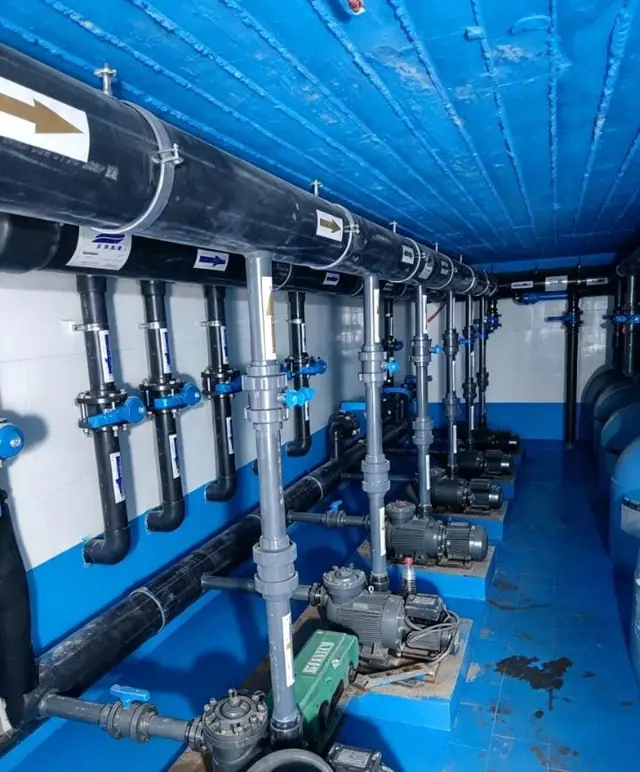 Plant-room corridor with overhead supply lines