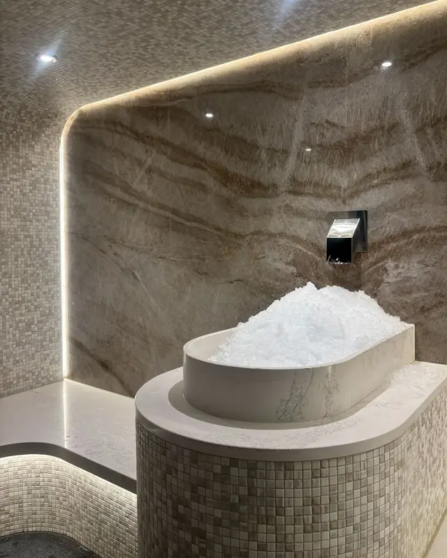 Ice fountain on a mosaic plinth with linear lighting
